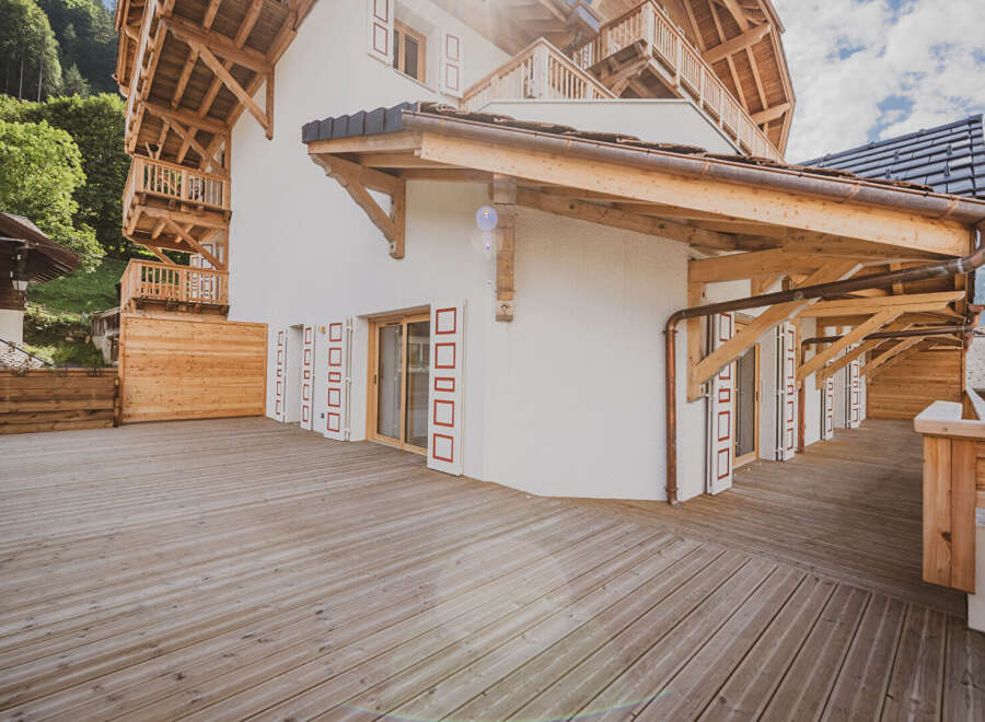 This stunning property boasts a beautiful wooden deck, perfect for enjoying the outdoors.