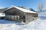 This charming wooden barn, nestled in a snowy landscape, offers a unique opportunity for those seeking a rustic retreat.