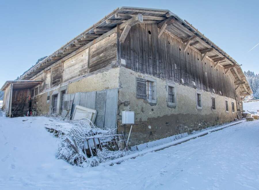 Discover this charming rustic property nestled in a snowy landscape.