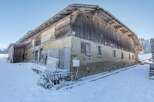 Discover this charming rustic property nestled in a snowy landscape.