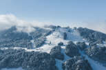 Explore the beauty of this stunning mountain property, perfect for winter enthusiasts.