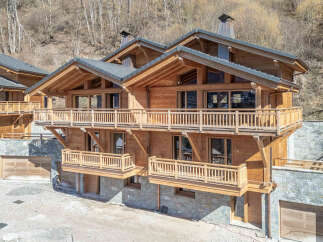 Discover the epitome of luxury living in this stunning wooden chalet nestled in a picturesque mountain setting.