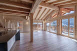 Experience the warmth of this stunning wooden chalet, boasting a spacious open-plan living area.