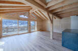 Experience the warmth of this stunning wooden chalet, boasting a spacious interior and breathtaking mountain views.