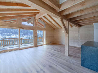 Experience the warmth of this stunning wooden chalet, boasting a spacious interior and breathtaking mountain views.