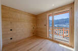 Experience the warmth of this inviting space, featuring stunning wood paneling and flooring that exudes natural charm.