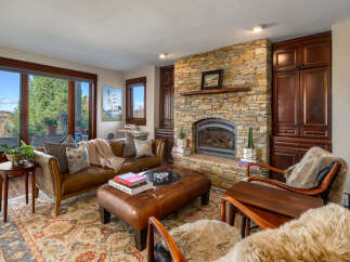 This stunning living room boasts a cozy fireplace, perfect for chilly evenings.