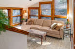 Step into this inviting living space, featuring a cozy sectional sofa and a stylish patterned rug.