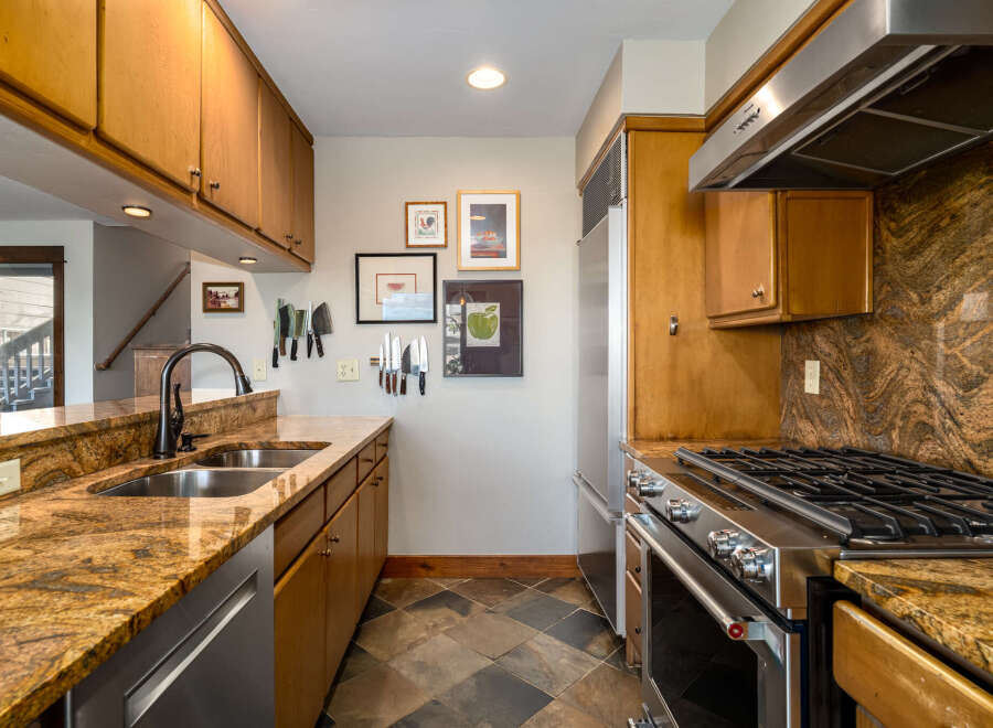 This stunning kitchen boasts a warm and inviting atmosphere, perfect for culinary enthusiasts.