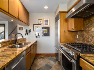 This stunning kitchen boasts a warm and inviting atmosphere, perfect for culinary enthusiasts.
