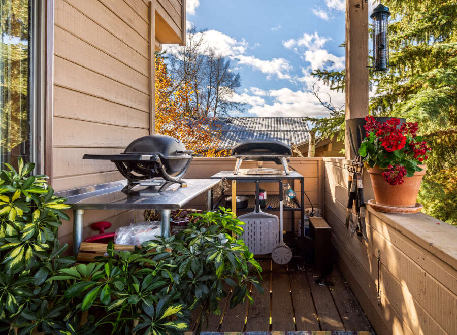 Enjoy outdoor living at its finest with this charming property! This space features a well-equipped outdoor kitchen, perfect for entertaining and culinary adventures.