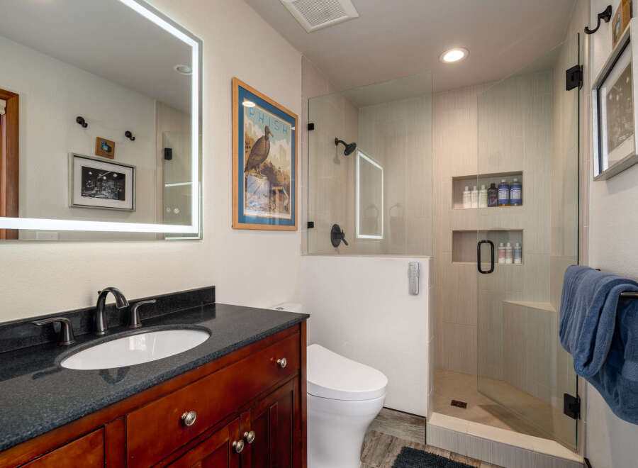 Step into luxury with this beautifully designed bathroom! Featuring a sleek vanity, a modern toilet, and a spacious glass-enclosed shower, this space is both stylish and functional.
