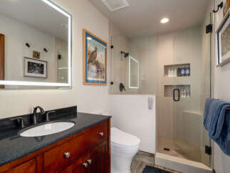 Step into luxury with this beautifully designed bathroom! Featuring a sleek vanity, a modern toilet, and a spacious glass-enclosed shower, this space is both stylish and functional.