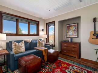 Step into this inviting living space, featuring a cozy blue sofa adorned with stylish throw pillows.