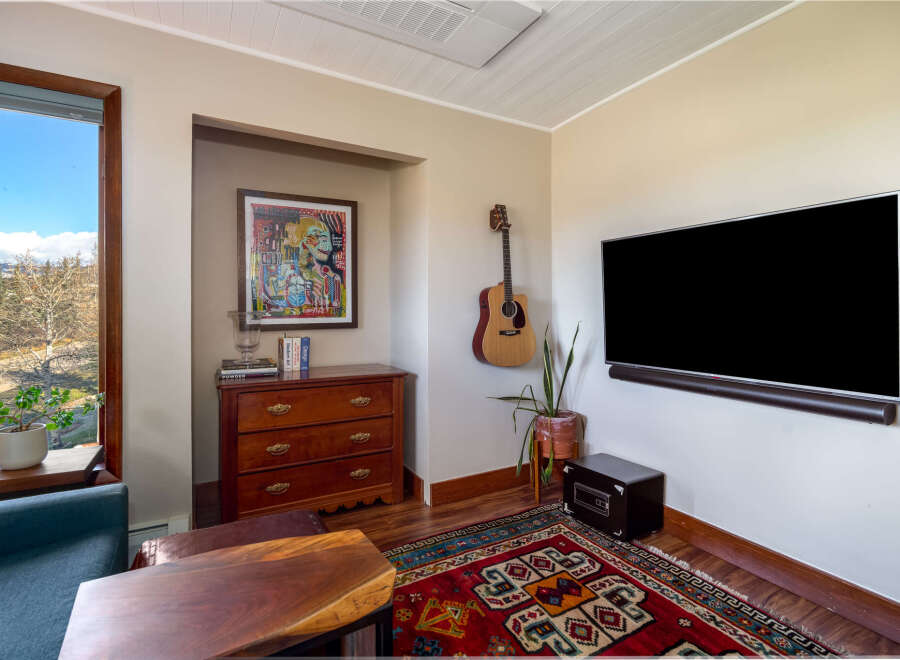 This stunning living room boasts a modern design with a touch of rustic charm.