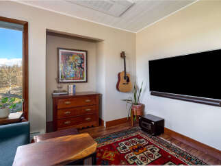 This stunning living room boasts a modern design with a touch of rustic charm.