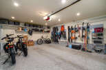 This spacious garage offers ample storage and organization solutions.
