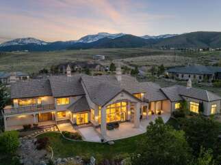 Experience luxury living in this stunning estate, boasting breathtaking mountain views and a meticulously designed exterior.