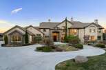 This stunning property boasts a grand entrance with a circular driveway, perfect for welcoming guests.