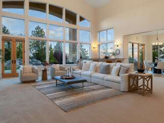 Experience luxury living in this stunning property, featuring expansive windows that flood the space with natural light.