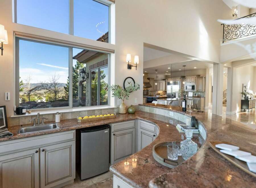 This stunning kitchen boasts a seamless blend of luxury and functionality, perfect for entertaining.