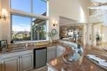 This stunning kitchen boasts a seamless blend of luxury and functionality, perfect for entertaining.