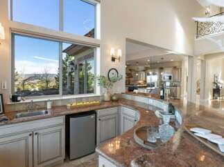 This stunning kitchen boasts a seamless blend of luxury and functionality, perfect for entertaining.