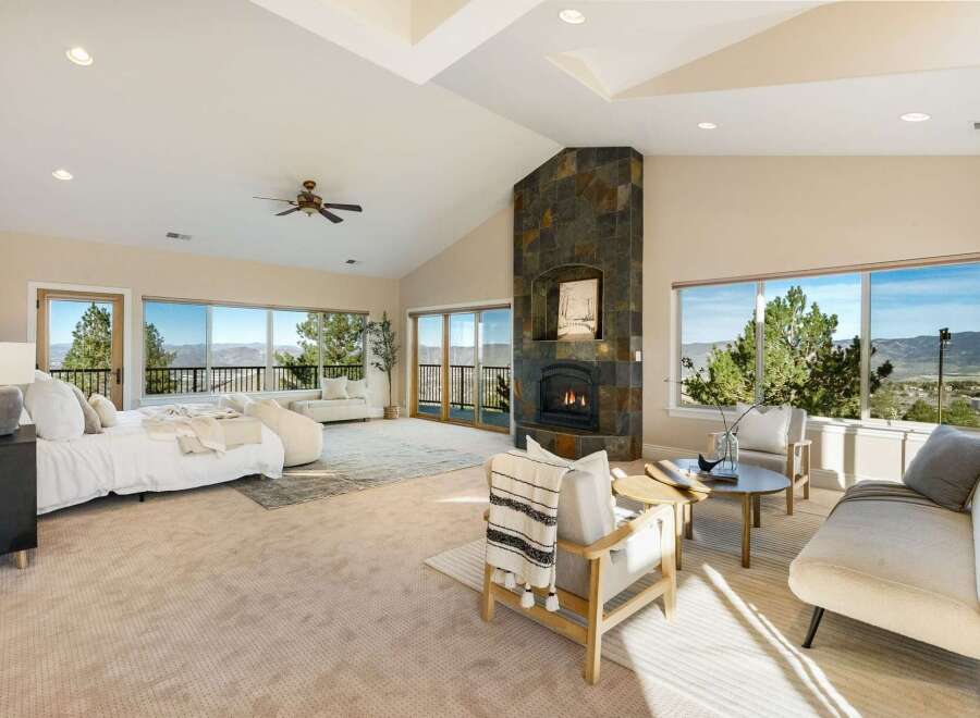 Experience luxury living in this stunning property, featuring a spacious bedroom with breathtaking views.