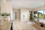Indulge in luxury within this stunning bathroom, featuring a spacious layout and elegant design.