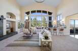 Experience luxury living in this stunning property, featuring an open-concept design with soaring ceilings and expansive windows that flood the space with natural light.