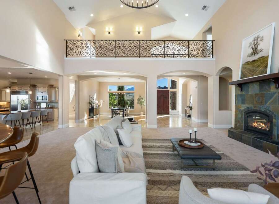 Step into luxury with this stunning home featuring a grand entrance and soaring ceilings.