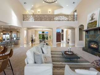 Step into luxury with this stunning home featuring a grand entrance and soaring ceilings.