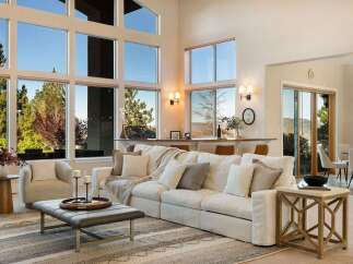 Experience luxury living in this stunning property, featuring expansive windows that flood the space with natural light and offer breathtaking views.