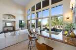Experience luxury living in this stunning property! This home boasts a spacious interior with high ceilings and large windows that flood the space with natural light.
