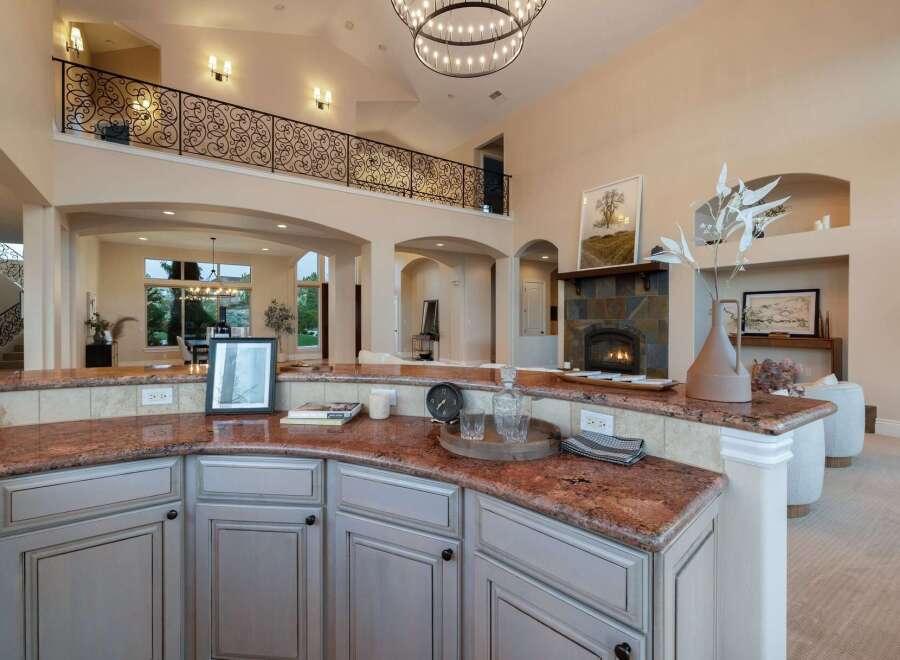 Experience luxury living in this stunning property, featuring a gourmet kitchen with granite countertops and custom cabinetry.
