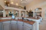 Experience luxury living in this stunning property, featuring a gourmet kitchen with granite countertops and custom cabinetry.