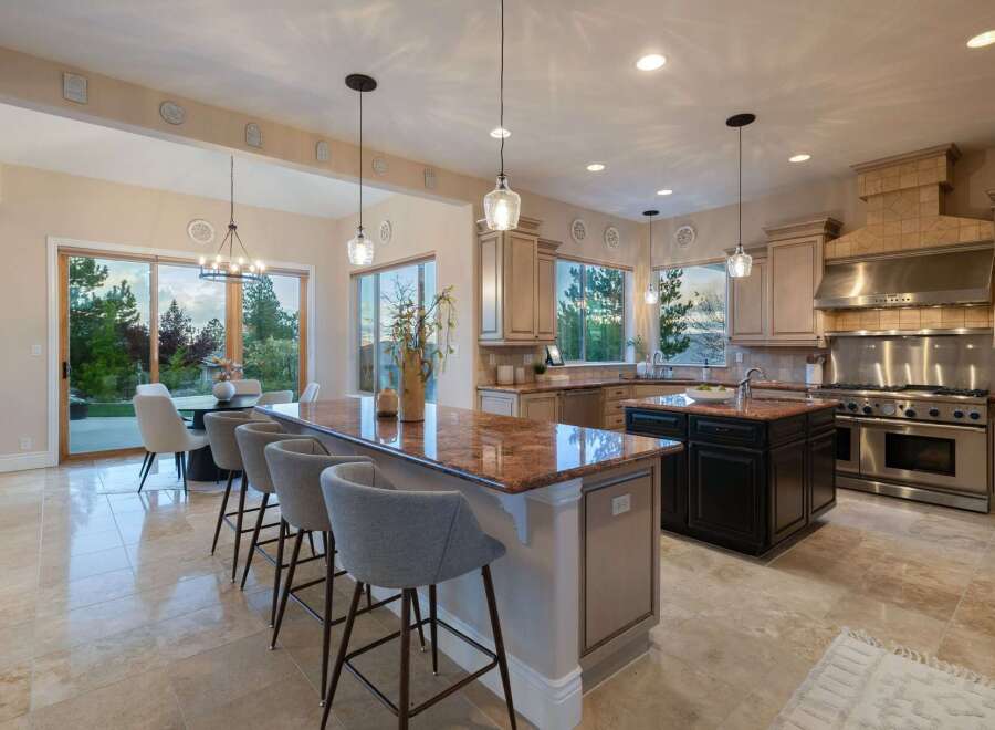 This stunning kitchen boasts a spacious layout with a large island, perfect for entertaining.