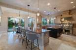 This stunning kitchen boasts a spacious layout with a large island, perfect for entertaining.