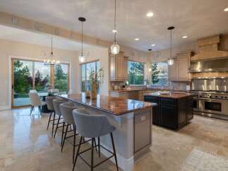 This stunning kitchen boasts a spacious layout with a large island, perfect for entertaining.