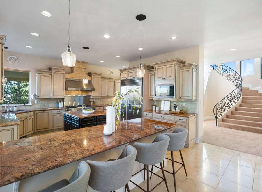 This stunning kitchen boasts a spacious layout, perfect for both cooking and entertaining.