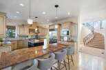 This stunning kitchen boasts a spacious layout, perfect for both cooking and entertaining.