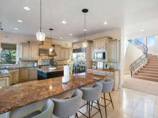 This stunning kitchen boasts a spacious layout, perfect for both cooking and entertaining.