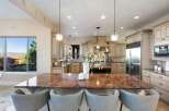 Step into luxury with this stunning kitchen, featuring a spacious island with seating, perfect for entertaining.