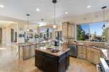 Experience luxury living in this stunning kitchen! Featuring a spacious island, granite countertops, and stainless steel appliances, this kitchen is perfect for both cooking and entertaining.