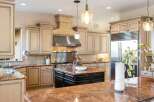 Step into luxury with this stunning kitchen! Featuring custom cabinetry, a stainless steel range hood, and granite countertops, this space is perfect for both cooking and entertaining.