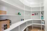 Discover the epitome of organization with this stunning pantry.