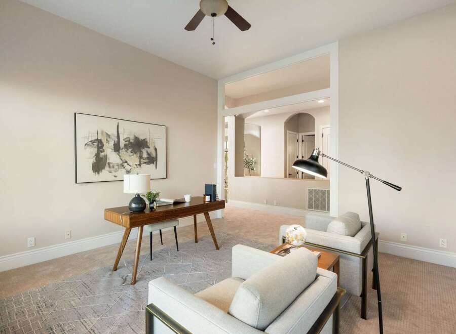 Step into luxury with this stunning property, featuring a beautifully designed home office.