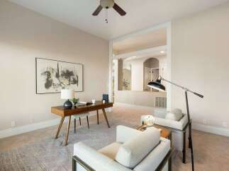 Step into luxury with this stunning property, featuring a beautifully designed home office.
