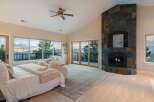 Experience luxury living in this stunning bedroom with breathtaking views.