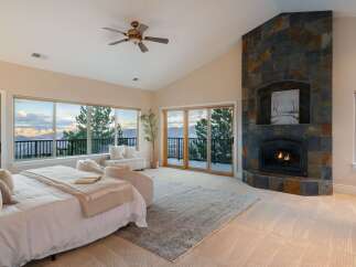 Experience luxury living in this stunning bedroom with breathtaking views.